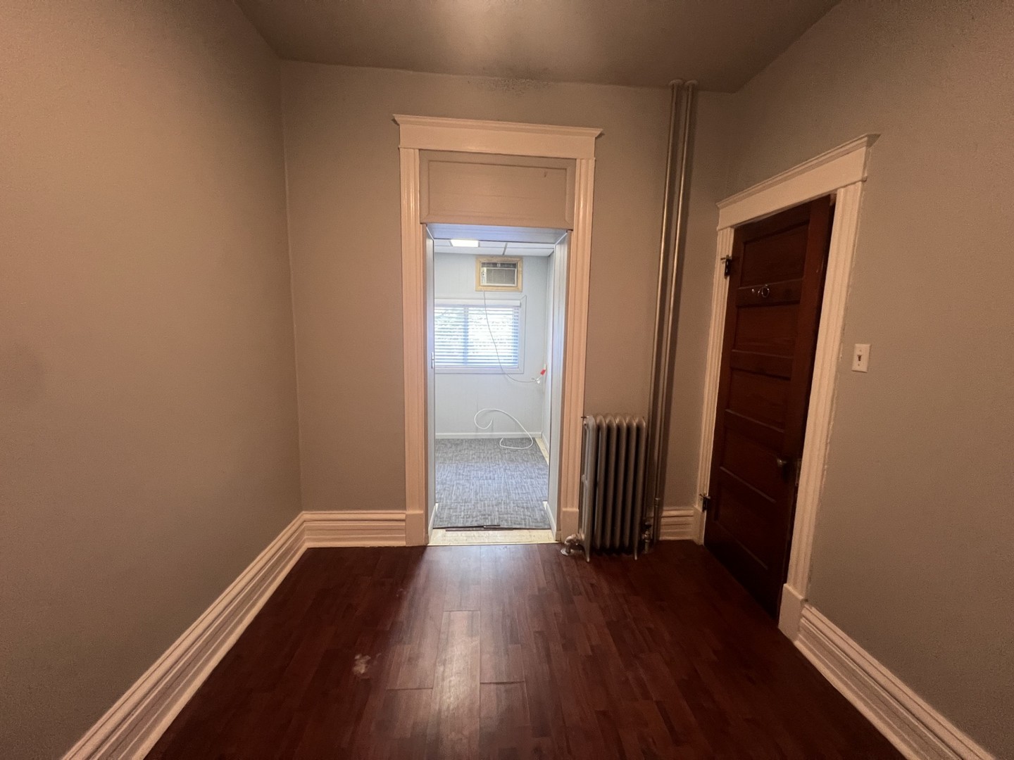 3545 North Sheffield Avenue, Unit 1 Chicago, IL 60657 - Photo 13 of 23 an empty room with wooden floor and closet