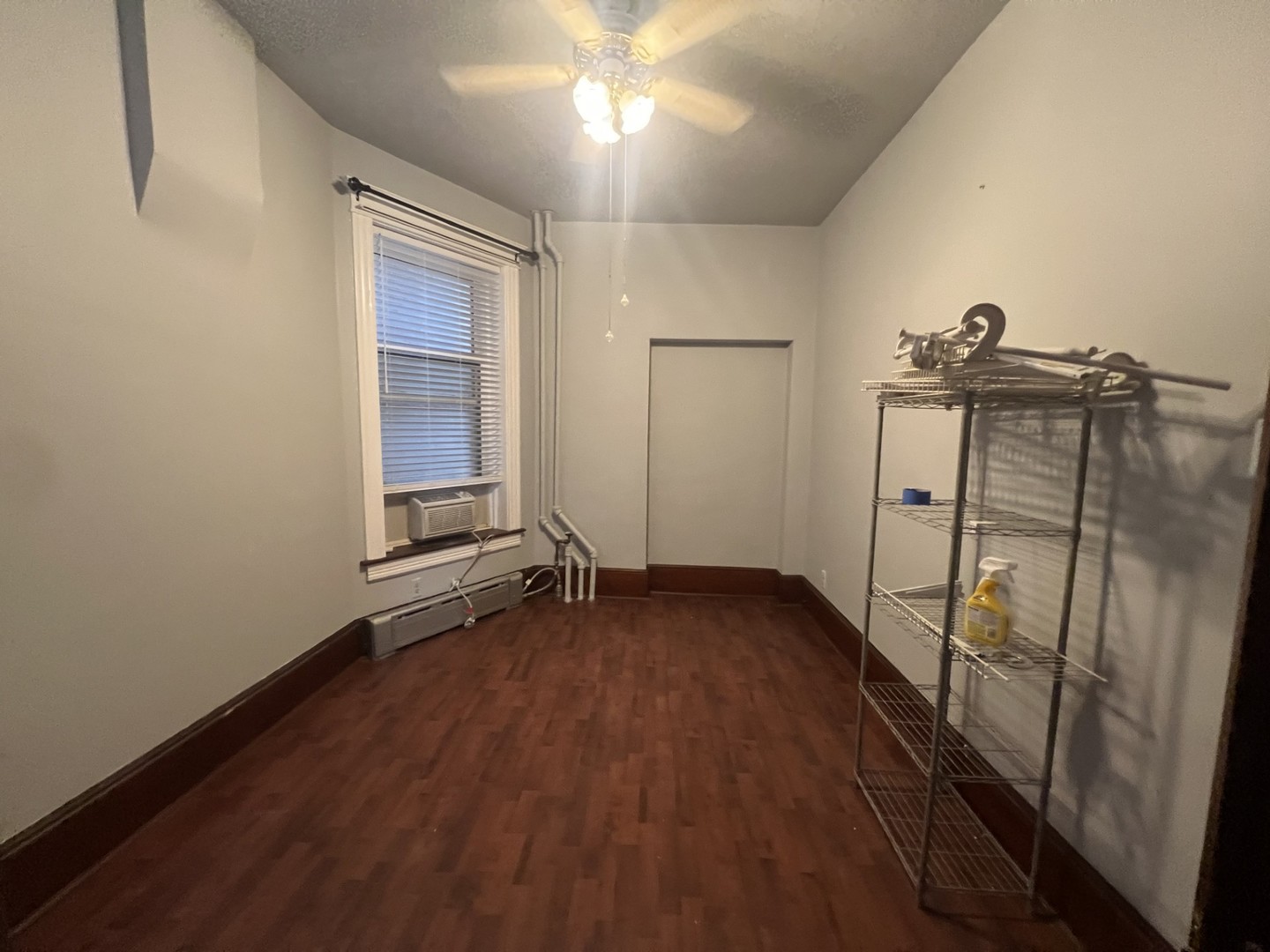 3545 North Sheffield Avenue, Unit 1 Chicago, IL 60657 - Photo 15 of 23 wooden floor in an empty room with a window
