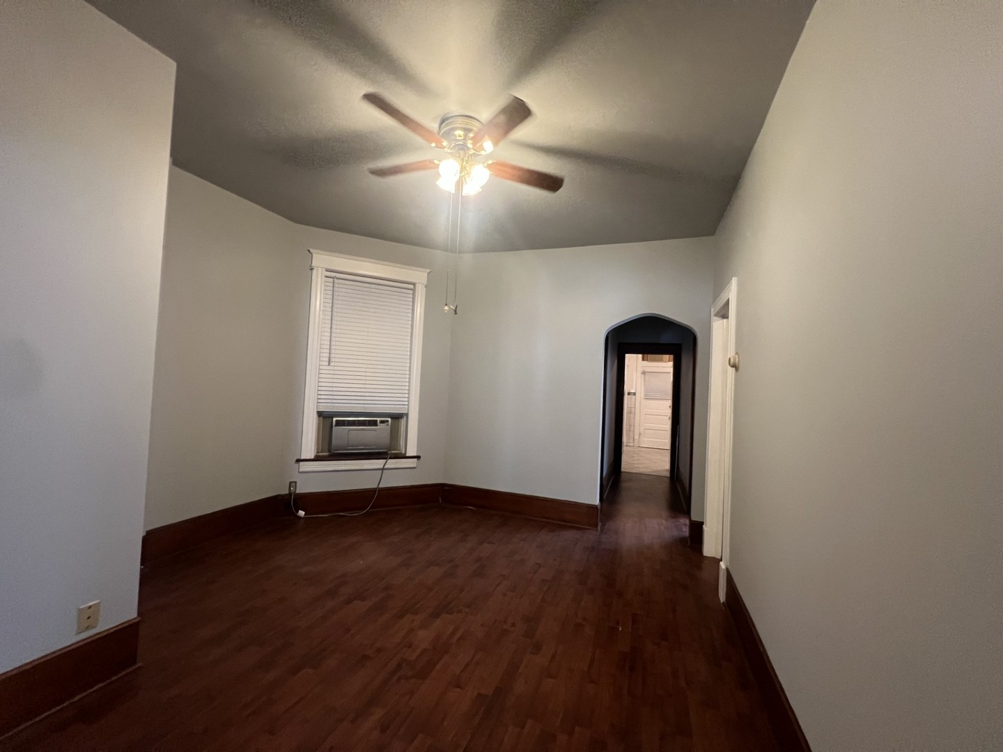 3545 North Sheffield Avenue, Unit 1 Chicago, IL 60657 - Photo 5 of 23 wooden floor in an empty room with a window
