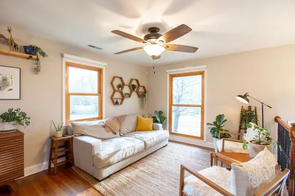 a living room with furniture and a large window