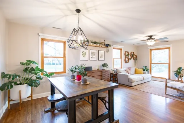 a large kitchen with a large window and stainless steel appliances