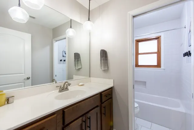 a living room with furniture and windows