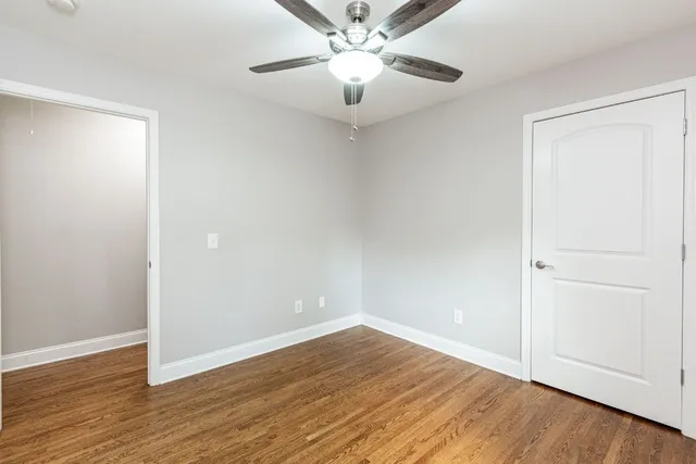 a bathroom with a sink a tub and a mirror