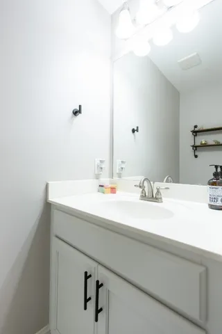 a spacious bedroom with a bed and a window