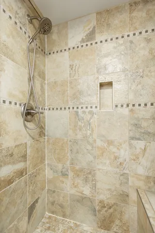 a view of balcony with wooden floor and fence