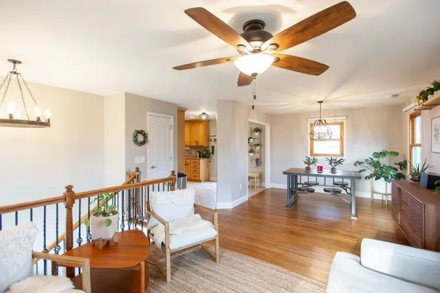a view of a chandelier and wooden floor in a room