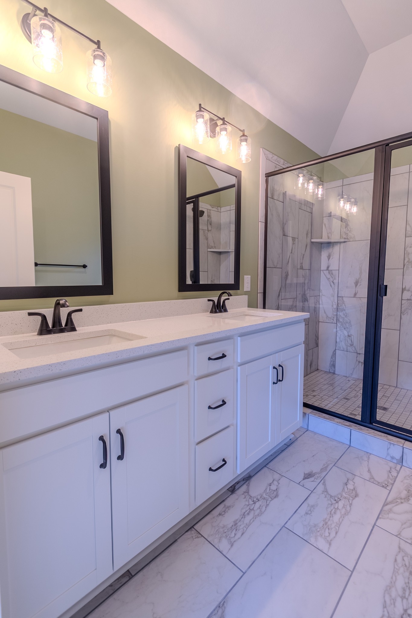 22 Garrettsburg Road Clarksville, TN 37042 - Photo 12 of 21 a bathroom with a double vanity sink a large mirror a shower and a bathtub