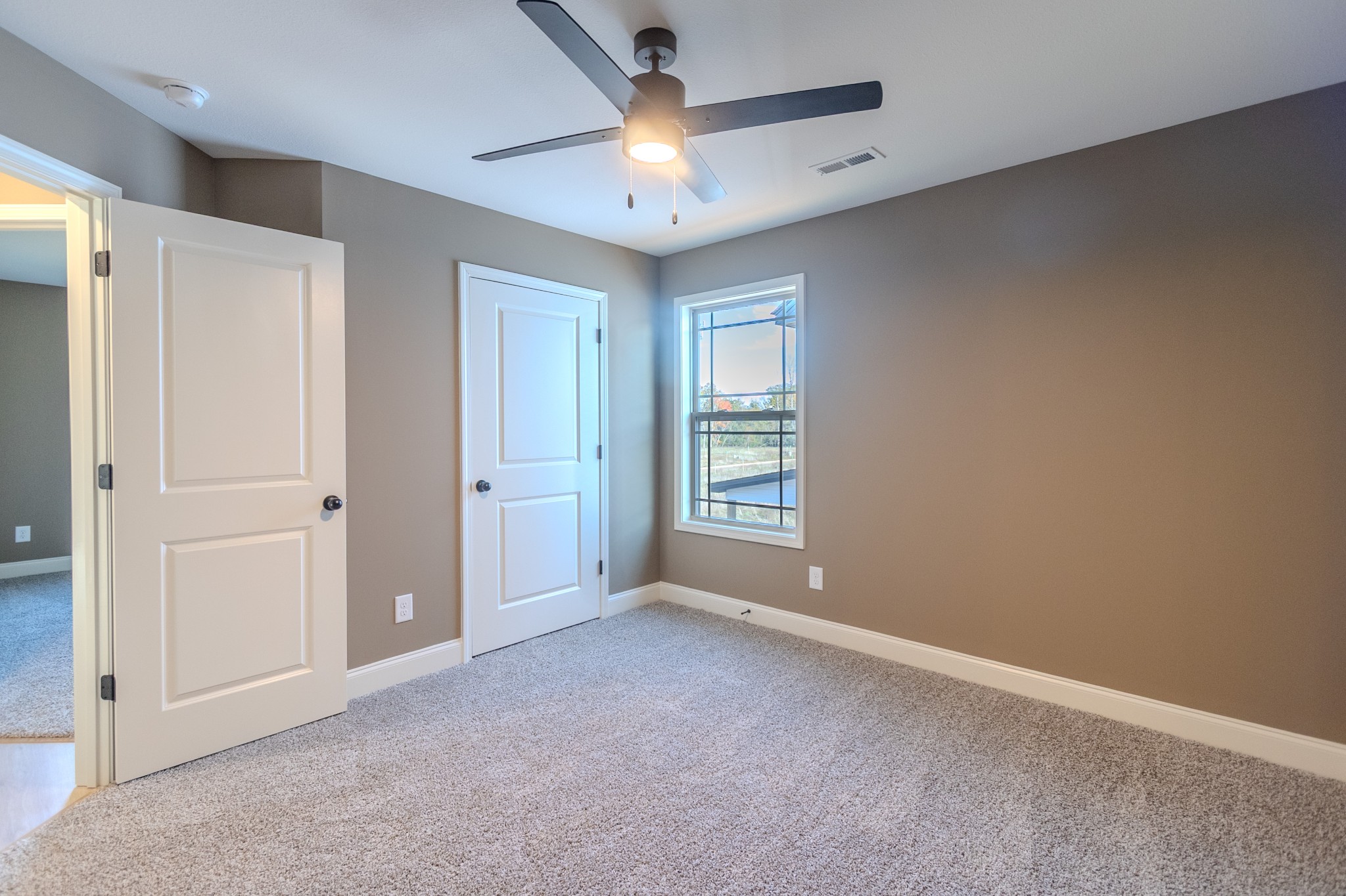 22 Garrettsburg Road Clarksville, TN 37042 - Photo 14 of 21 an empty room with windows and fan