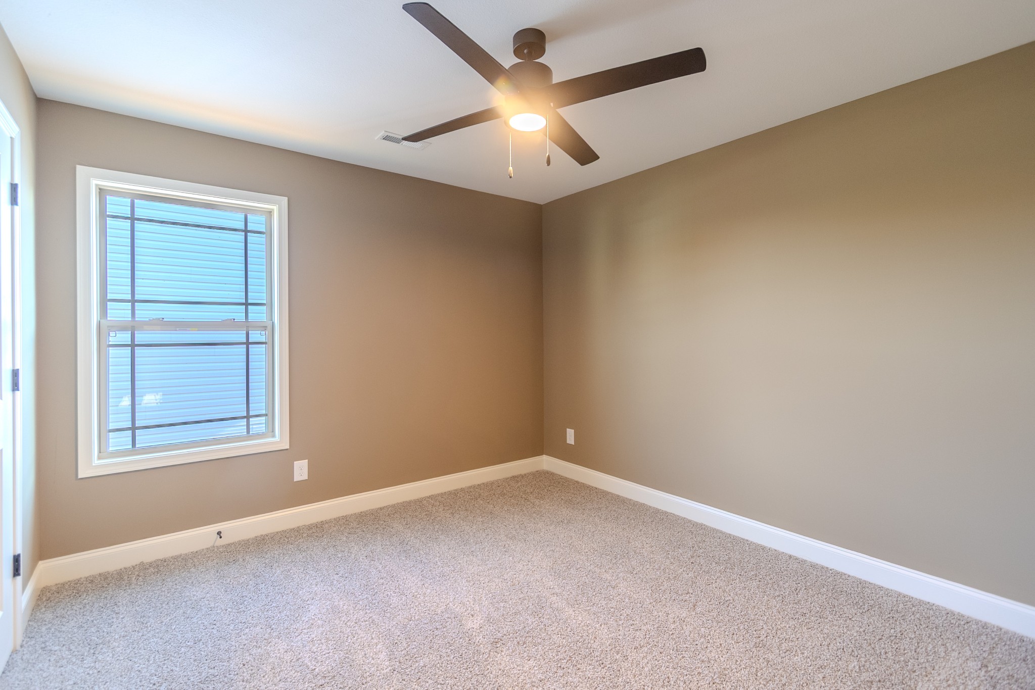 22 Garrettsburg Road Clarksville, TN 37042 - Photo 17 of 21 an empty room with a window and a fan