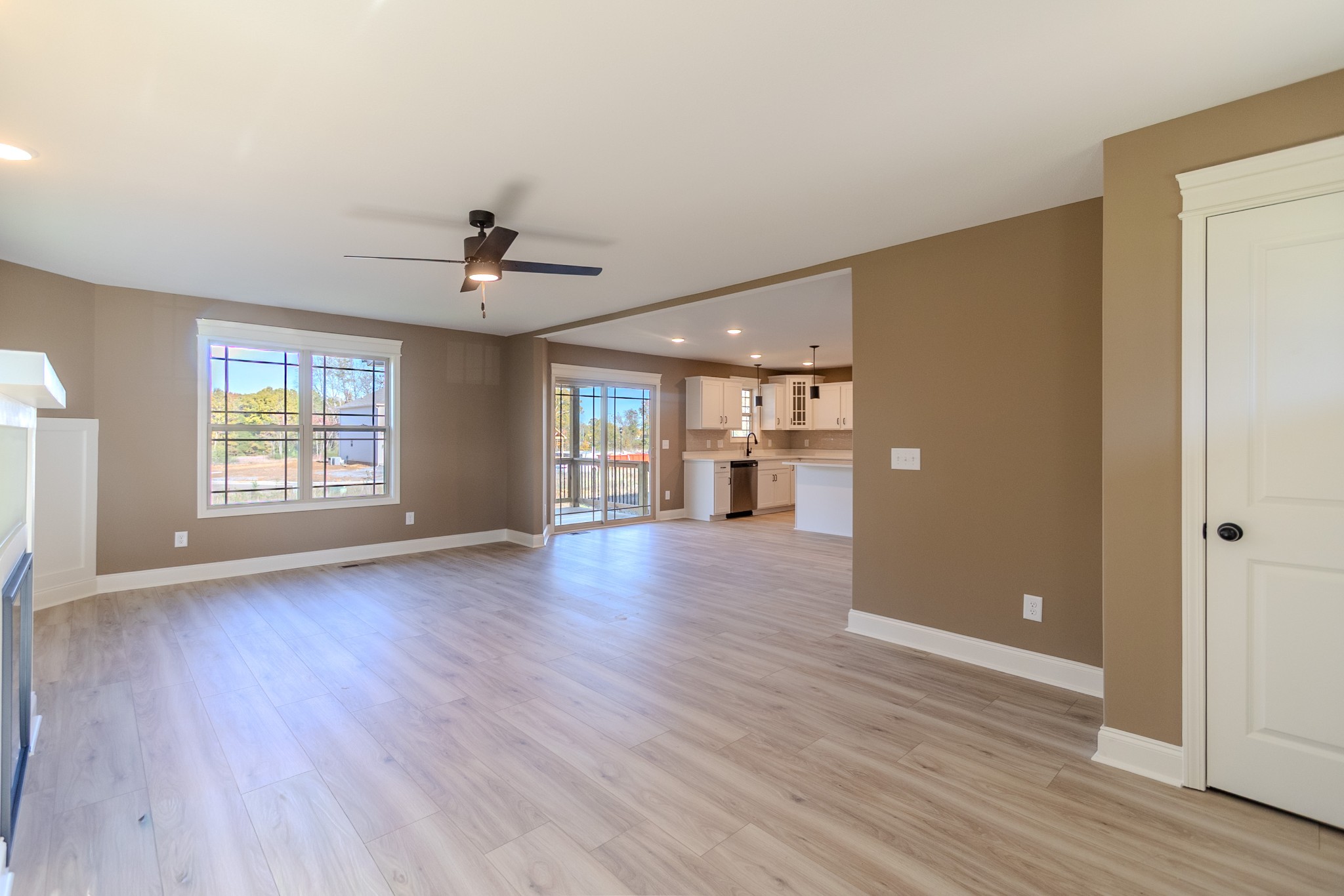 22 Garrettsburg Road Clarksville, TN 37042 - Photo 2 of 21 an empty room with wooden floor and windows