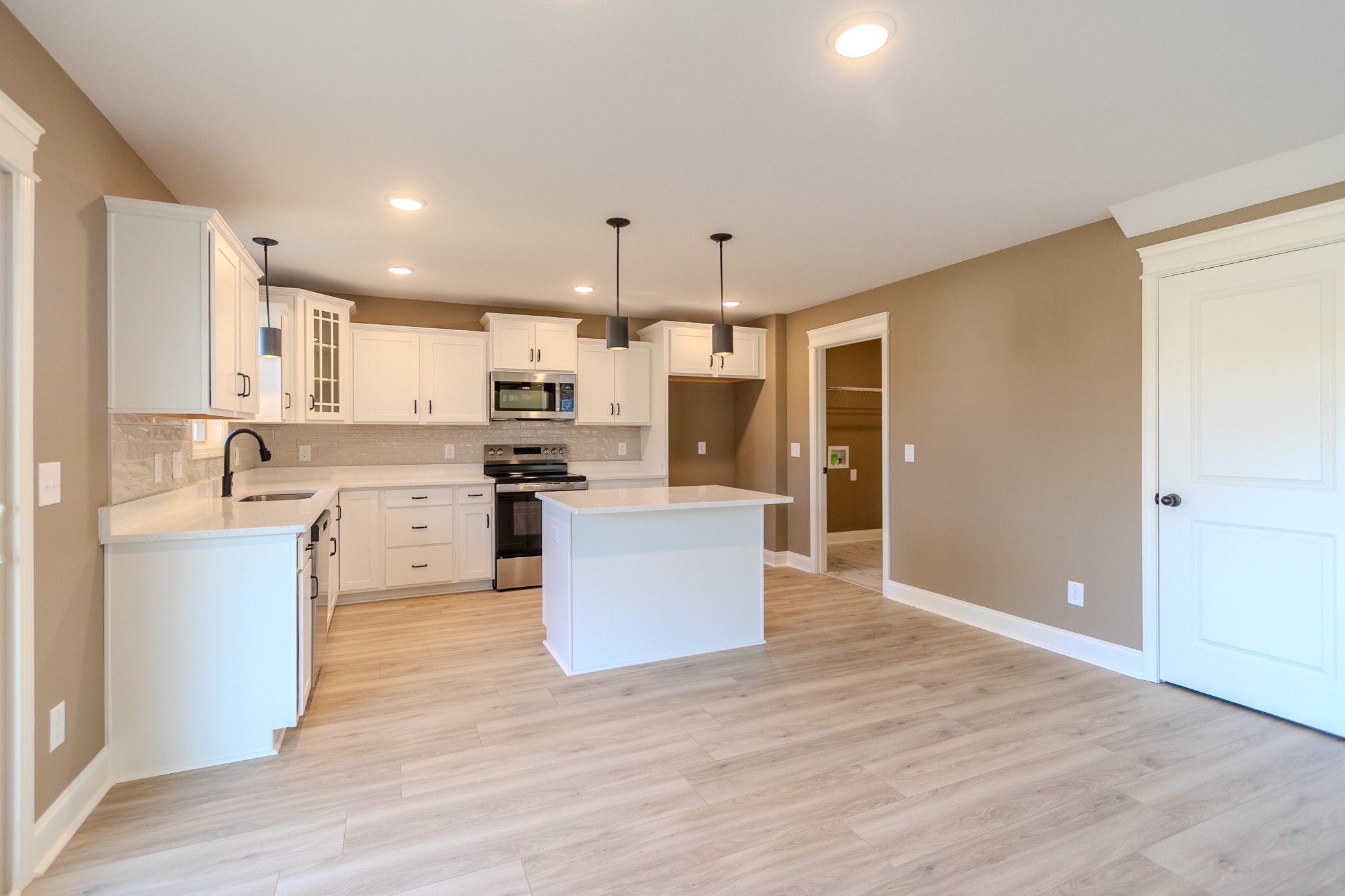 22 Garrettsburg Road Clarksville, TN 37042 - Photo 4 of 21 a kitchen with stainless steel appliances kitchen island wooden cabinets and refrigerator