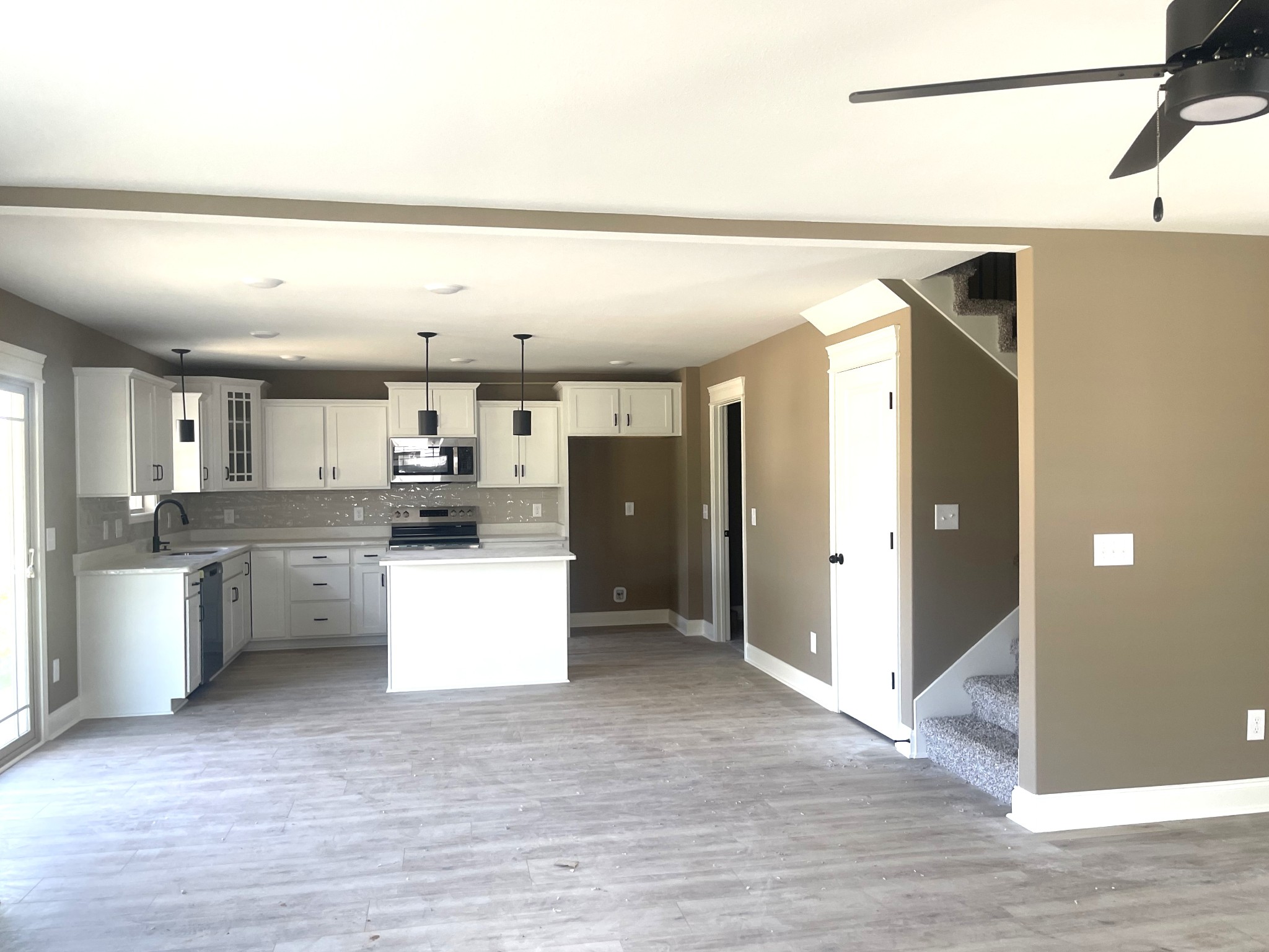 22 Garrettsburg Road Clarksville, TN 37042 - Photo 6 of 21 a open kitchen with white cabinets and stainless steel appliances