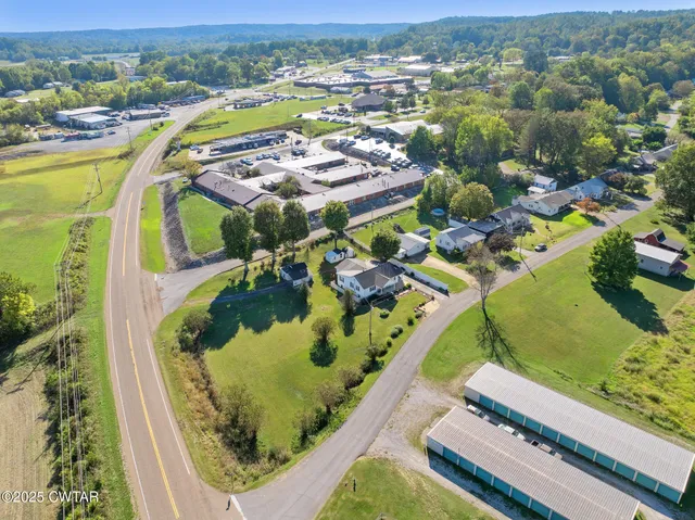an aerial view of a swimming pool with a mountain view