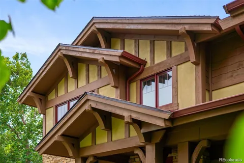 a view of a car parked front of a house