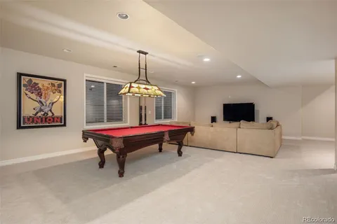 a room with furniture and pool table