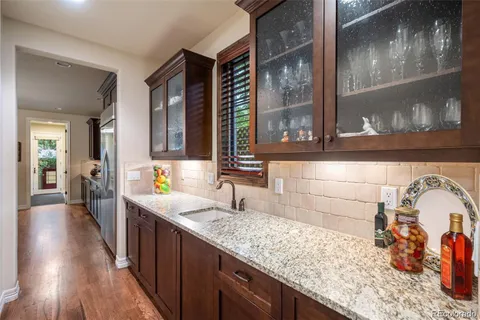a kitchen with sink and cabinets