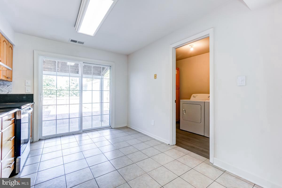 1111 Providence Court Frederick, MD 21703 - Photo 12 of 30 a view of an empty room with a fireplace and a window