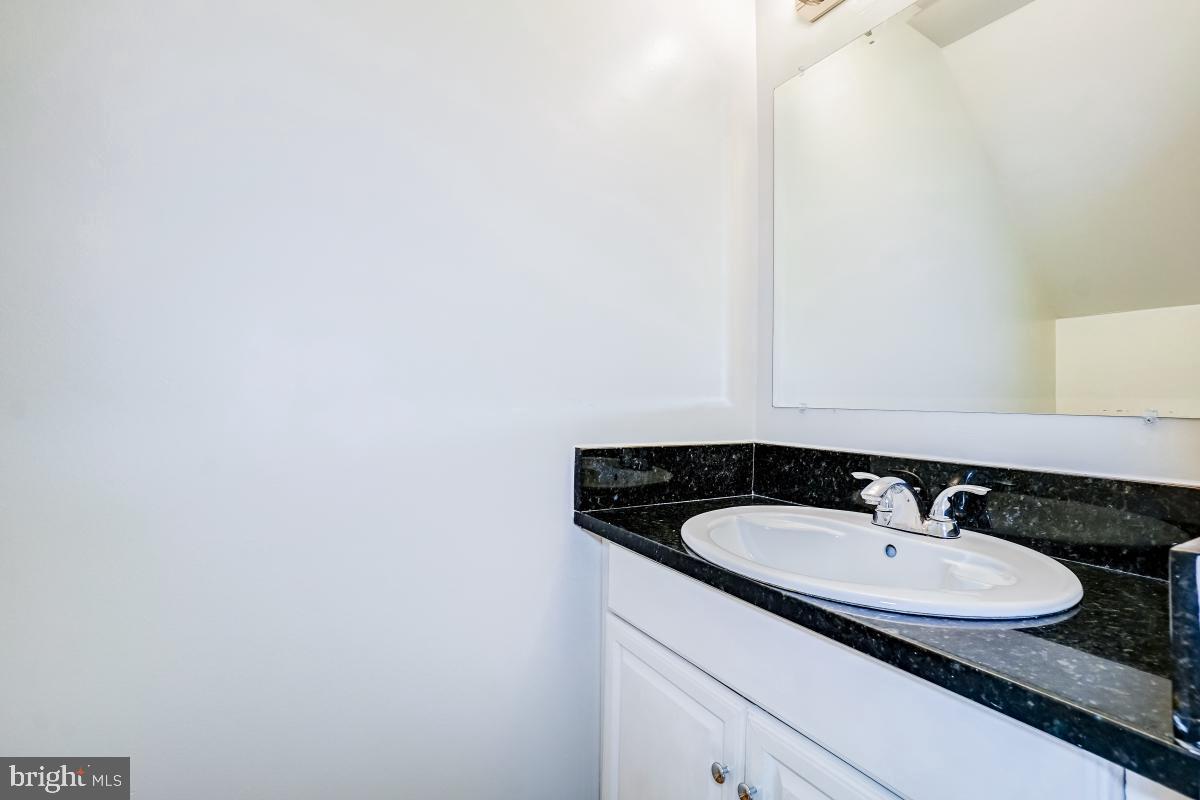 1111 Providence Court Frederick, MD 21703 - Photo 14 of 30 a bathroom with a sink and a mirror