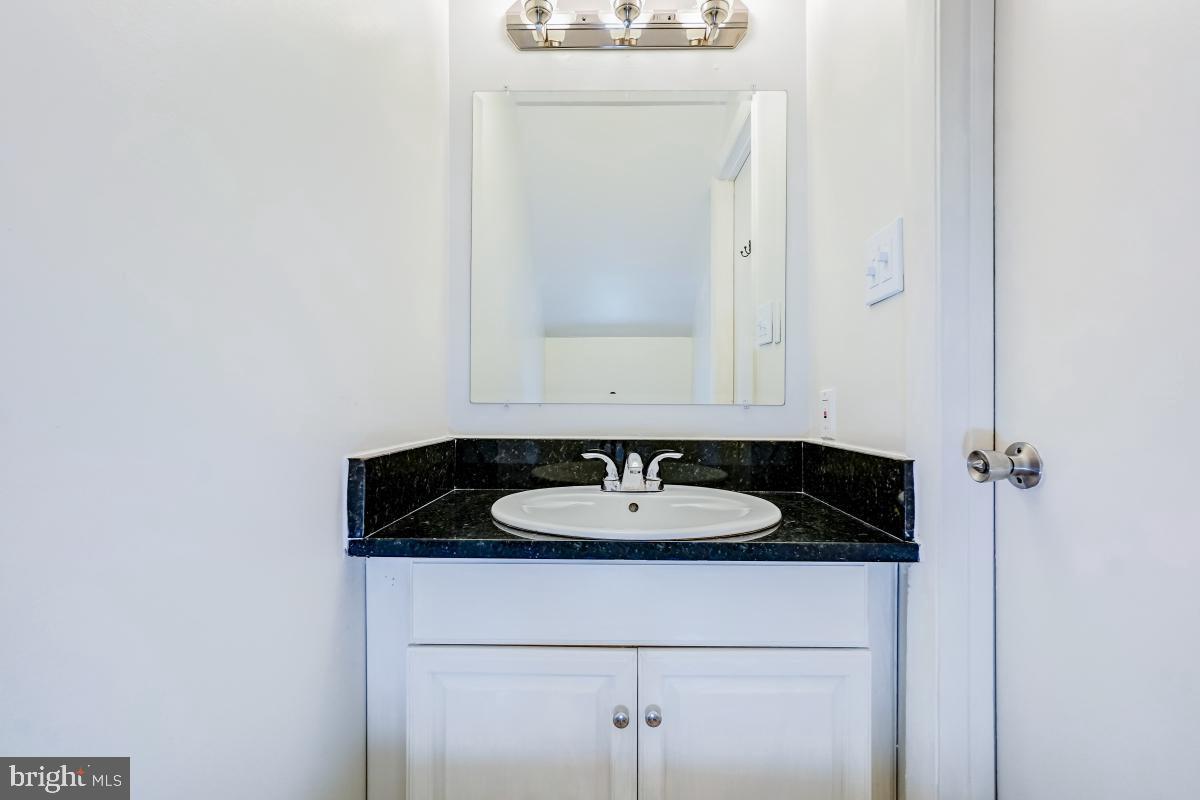 1111 Providence Court Frederick, MD 21703 - Photo 15 of 30 a bathroom with a sink and a mirror
