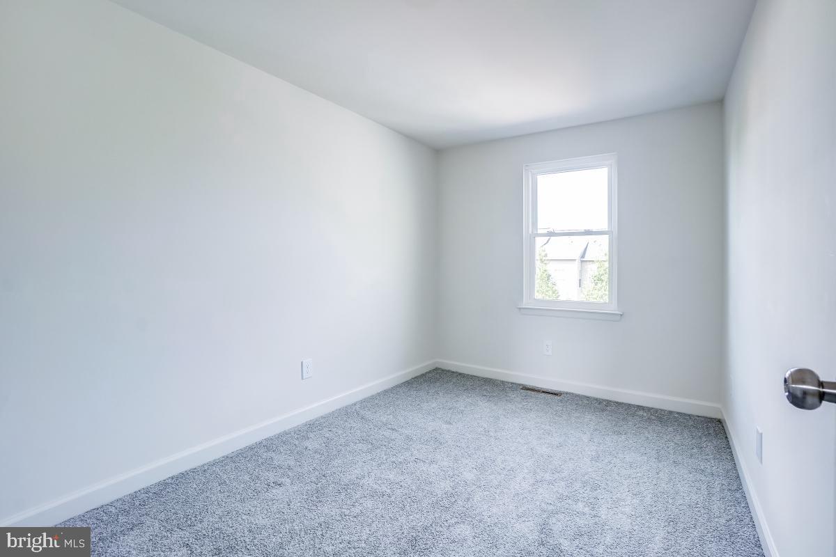 1111 Providence Court Frederick, MD 21703 - Photo 23 of 30 an empty room with a window