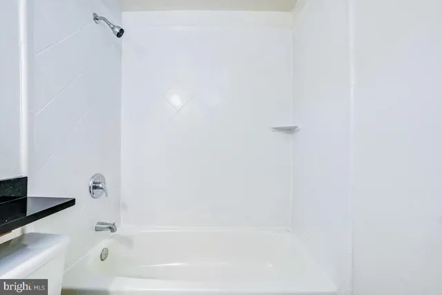 a view of a house with backyard and a porch