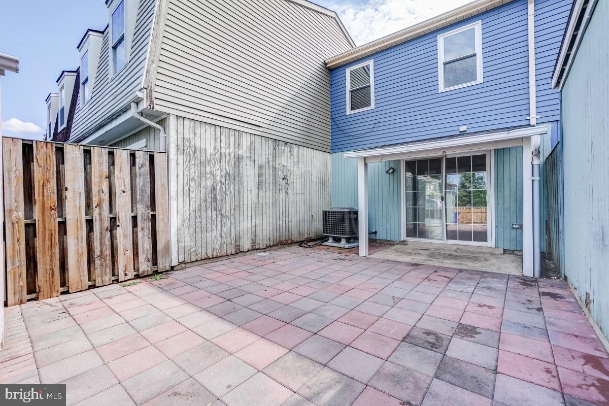 1111 Providence Court Frederick, MD 21703 - Photo 27 of 30 a view of a house with backyard and a porch