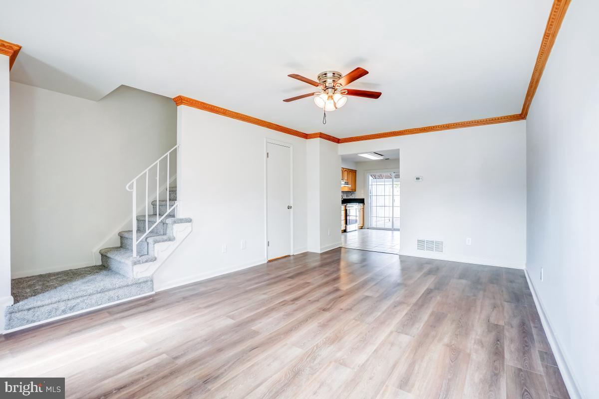 1111 Providence Court Frederick, MD 21703 - Photo 3 of 30 a view of an empty room with wooden floor and a window