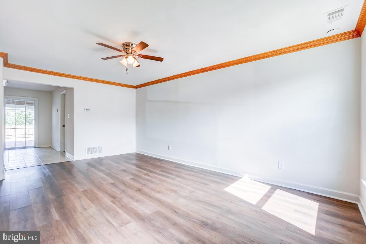1111 Providence Court Frederick, MD 21703 - Photo 4 of 30 a view of a room with wooden floor and white walls