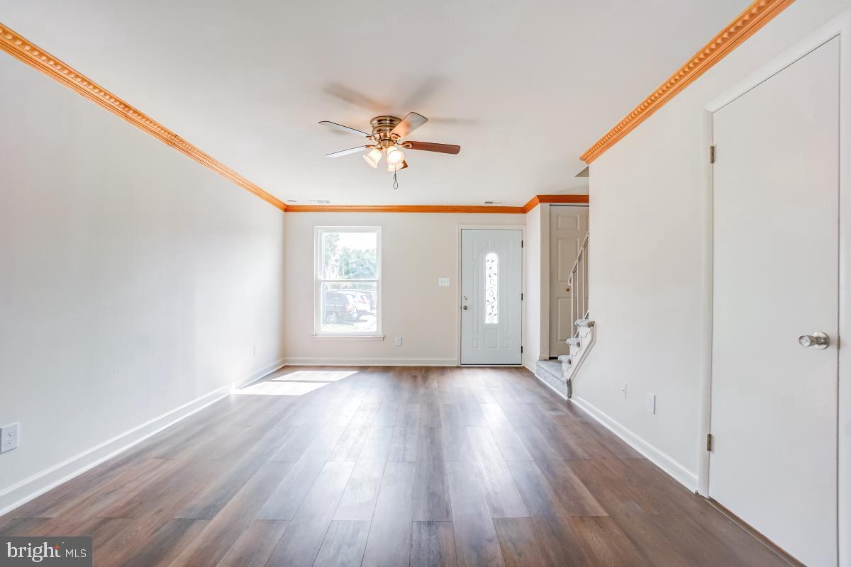 1111 Providence Court Frederick, MD 21703 - Photo 6 of 30 a view of room with window ceiling fan and hardwood floor