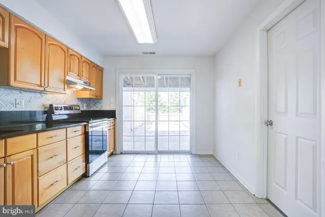 a view of a kitchen with electric appliances