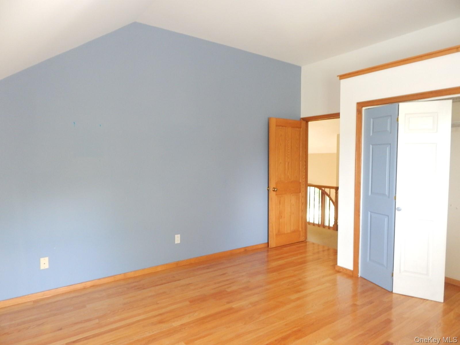 5 Eagle Head Road Cornwall-on-Hudson, NY 12520 - Photo 13 of 24 a view of an empty room with wooden floor and a window