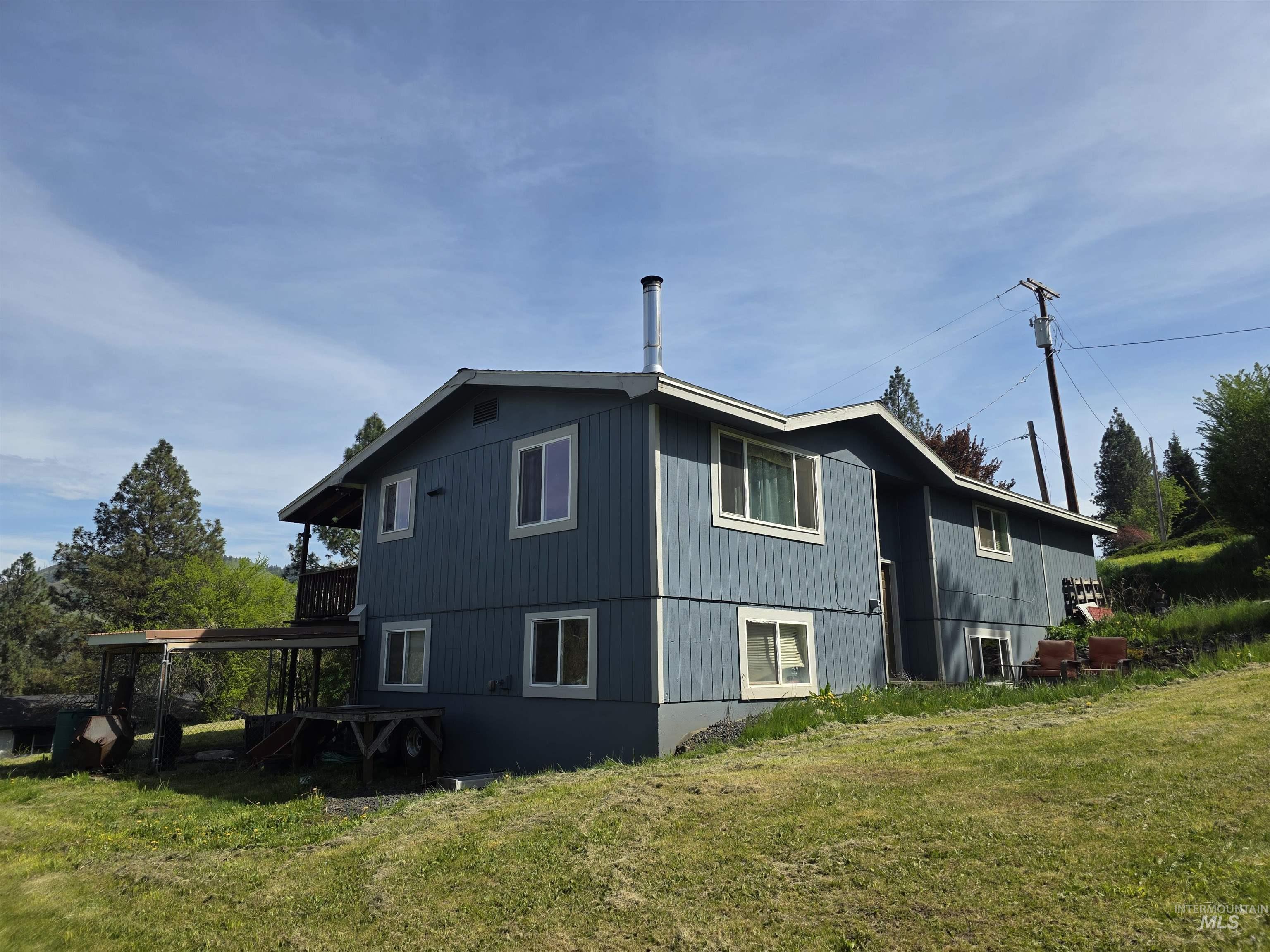 223 Larch Road Kamiah, ID 83536 - Photo 2 of 25 Split-level residence featuring blue siding and white trim