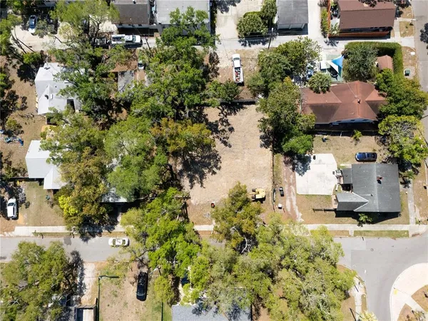 an aerial view of a house with a yard and garden