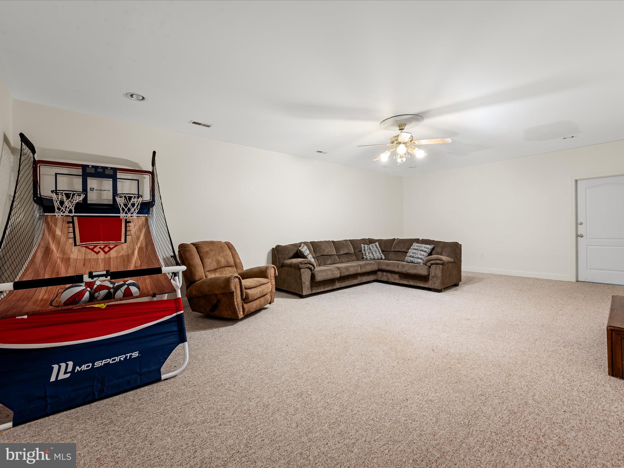 2358 Cave Ridge Road Mount Jackson, VA 22842 - Photo 29 of 59 a living room with furniture and air hockey table