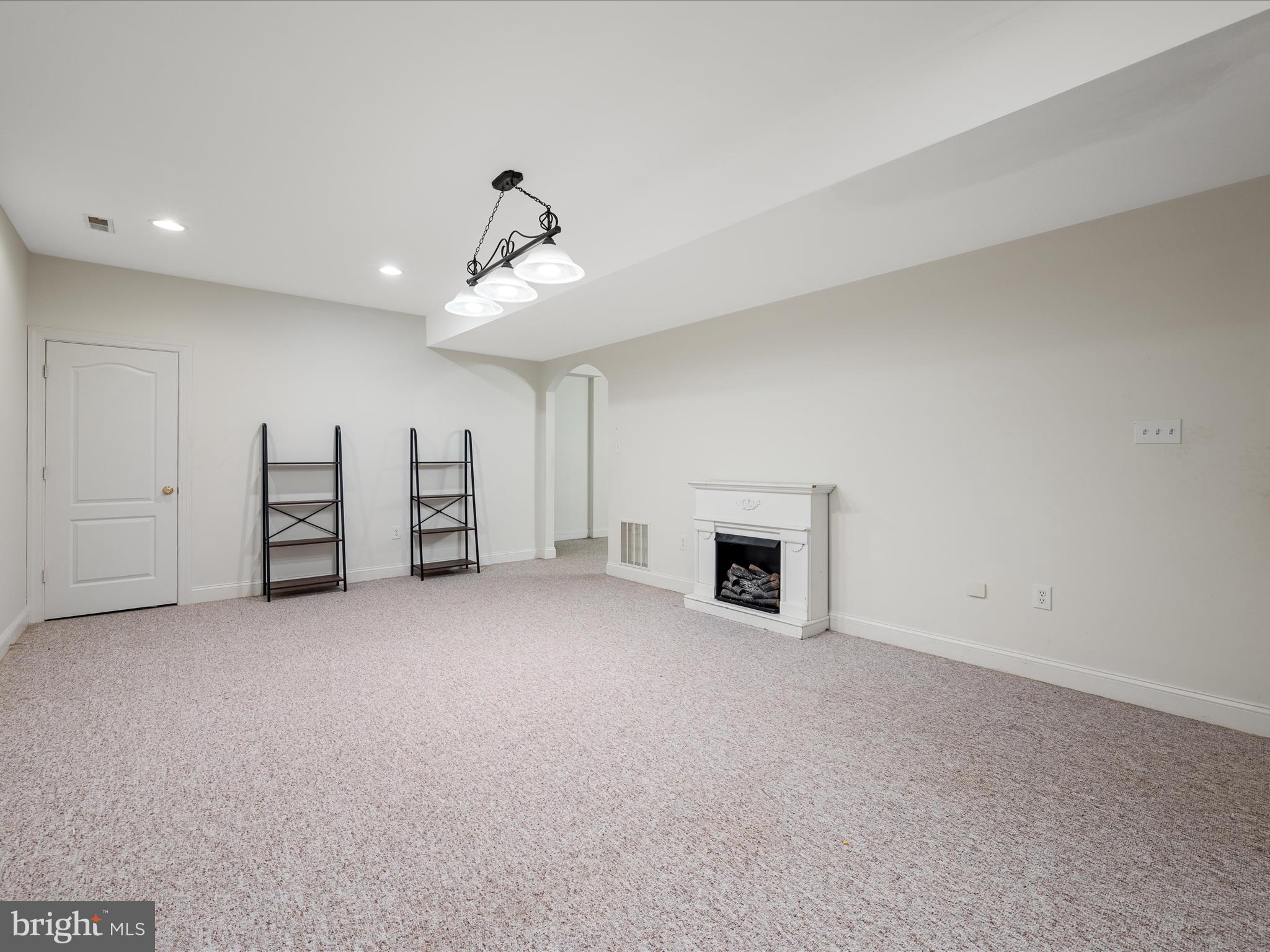 2358 Cave Ridge Road Mount Jackson, VA 22842 - Photo 32 of 59 a view of a livingroom with a fireplace a ceiling fan and window