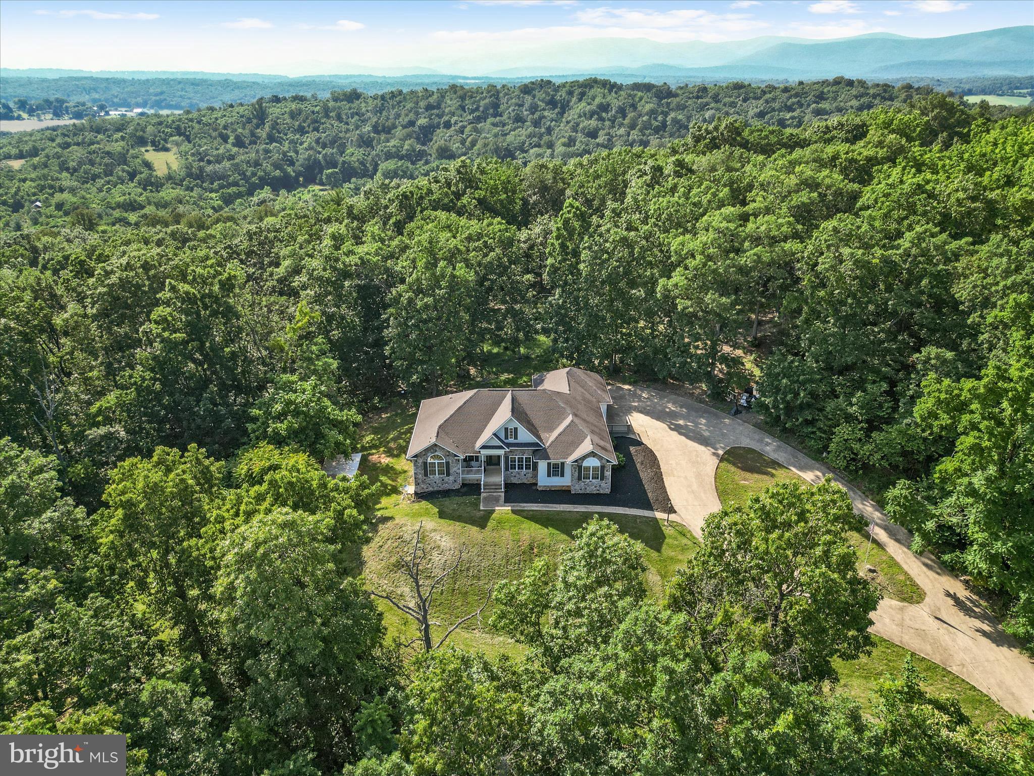 2358 Cave Ridge Road Mount Jackson, VA 22842 - Photo 5 of 59 a view of a house with a yard and large trees