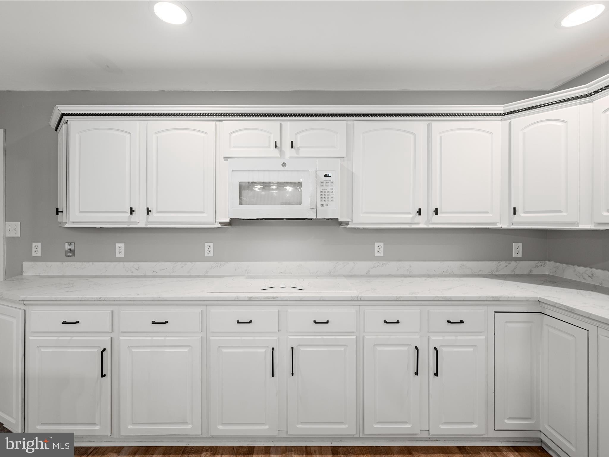 2358 Cave Ridge Road Mount Jackson, VA 22842 - Photo 8 of 59 a kitchen with white cabinets and white appliances