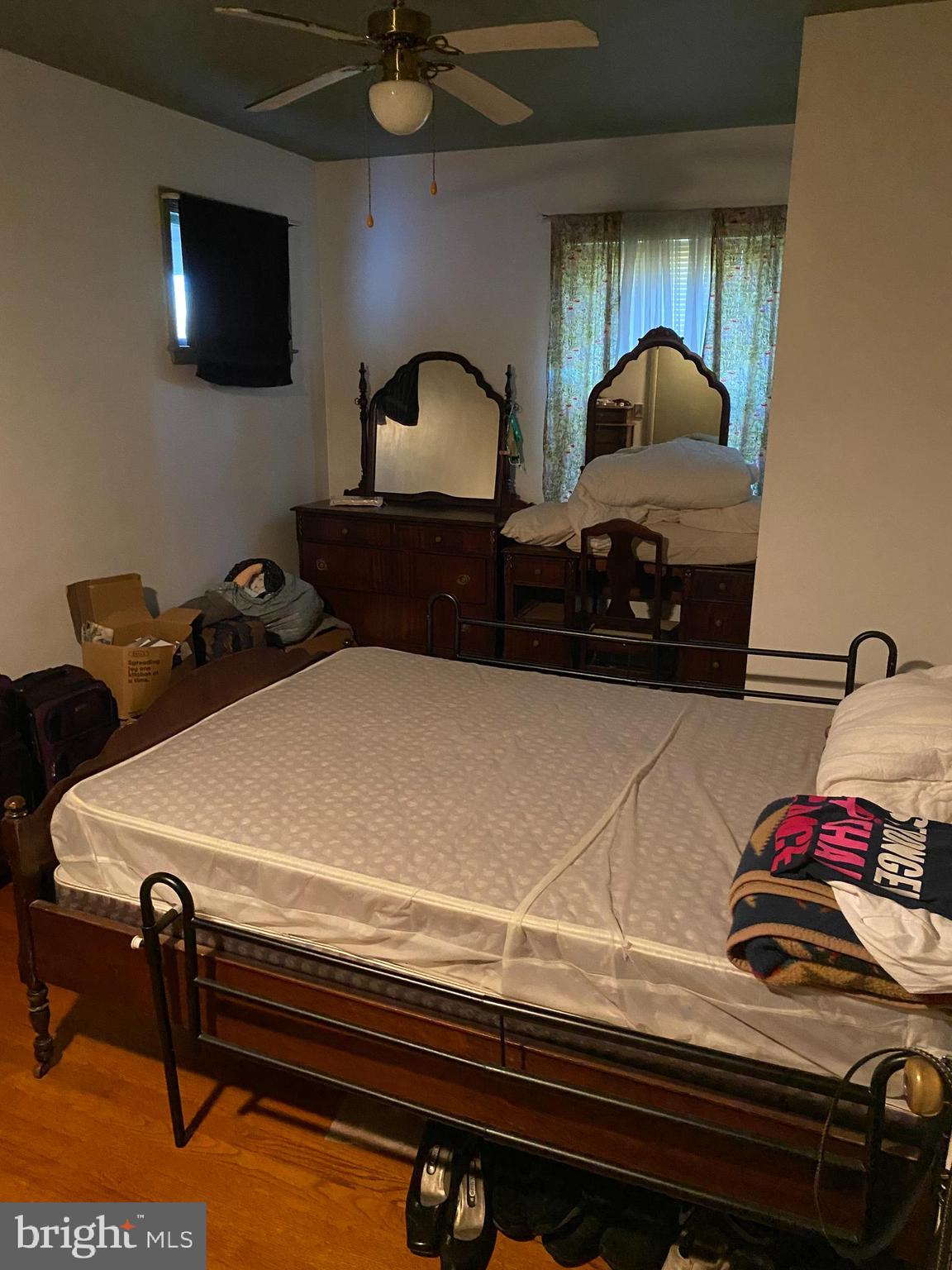 8305 Windsor Mill Road Baltimore, MD 21244 - Photo 12 of 15 a bedroom with bed and flat screen tv