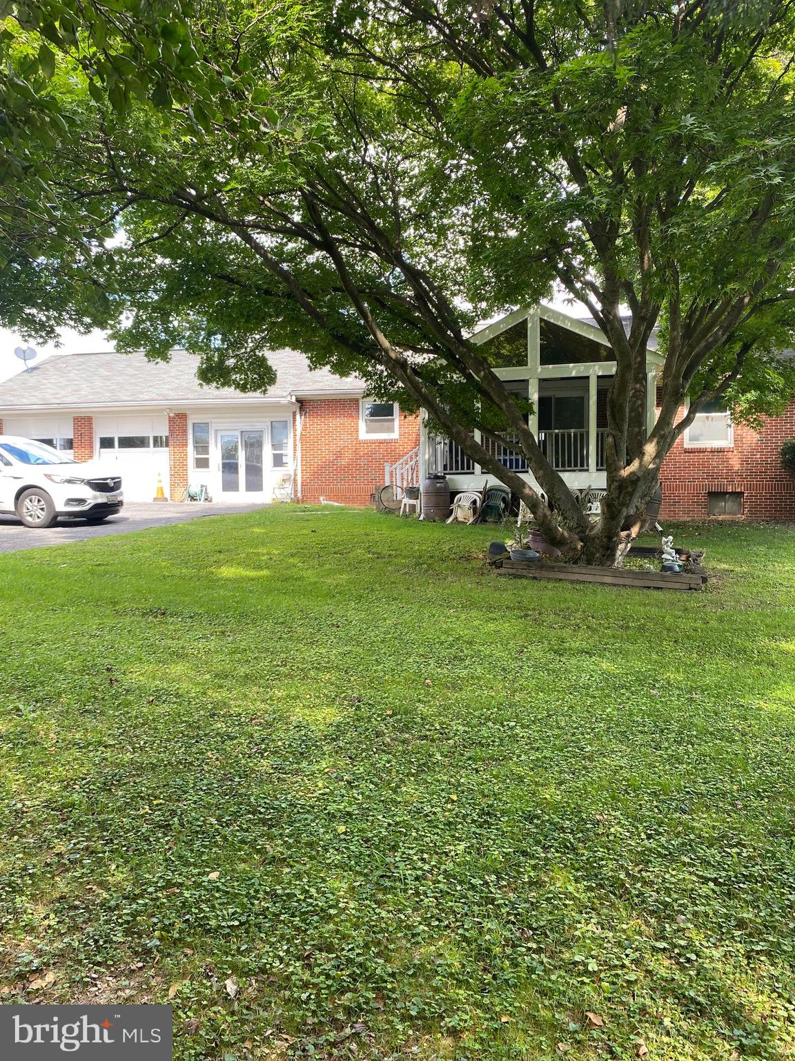 8305 Windsor Mill Road Baltimore, MD 21244 - Photo 2 of 15 a view of a house with a yard