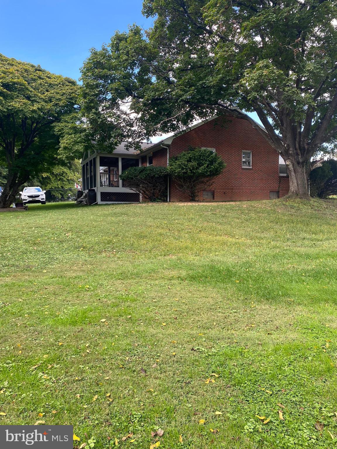 8305 Windsor Mill Road Baltimore, MD 21244 - Photo 4 of 15 a front view of a house with a garden
