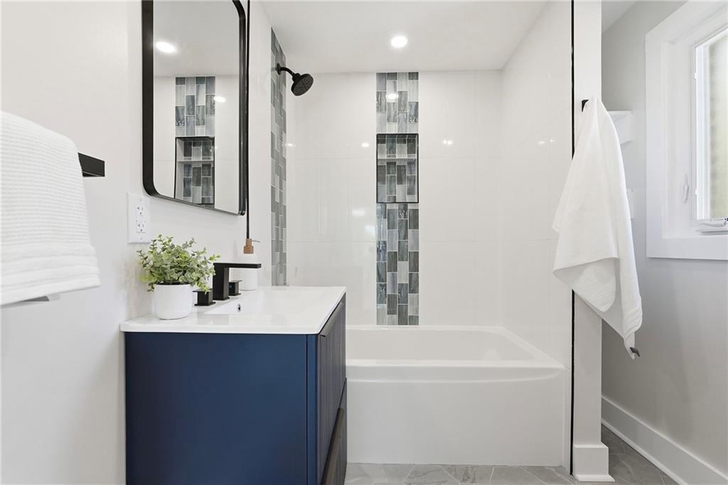 6501 Landview Road Pittsburgh, PA 15217 - Photo 24 of 41 a bathroom with a bathtub sink and mirror