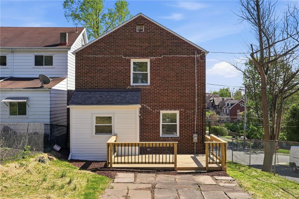 6501 Landview Road Pittsburgh, PA 15217 - Photo 32 of 41 a front view of a house with a garden