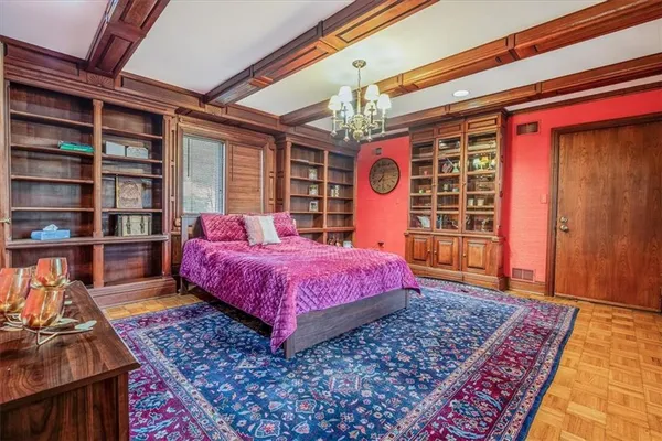 a bedroom with a bed and a bookshelf