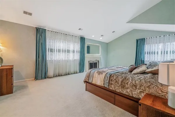 a bedroom with bed and window