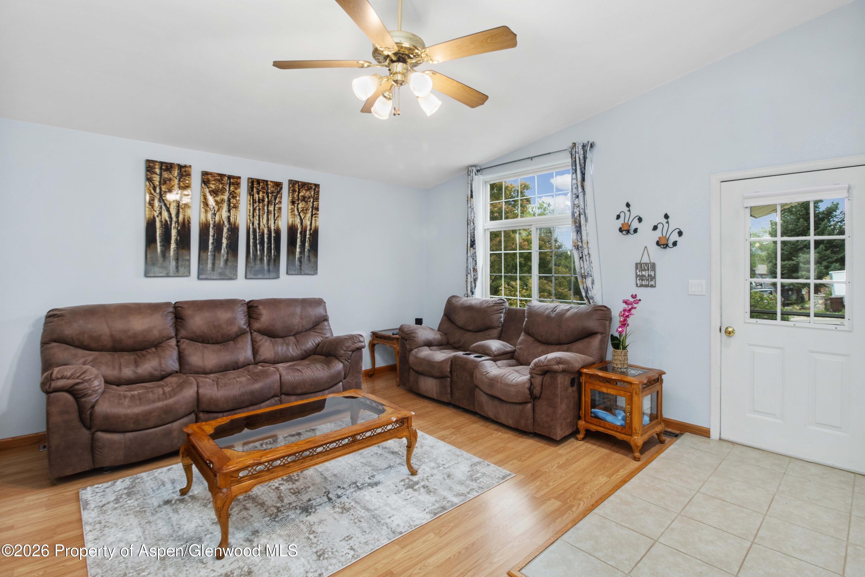 660 Aspen Avenue Rifle, CO 81650 - Photo 9 of 30 a living room with furniture and a window