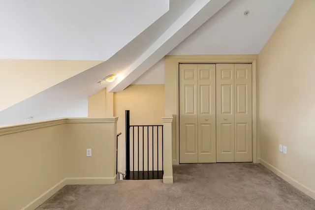 a view of kitchen with stainless steel appliances granite countertop a refrigerator and a sink