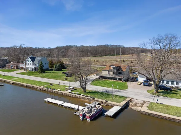 a view of a lake with a house in the background