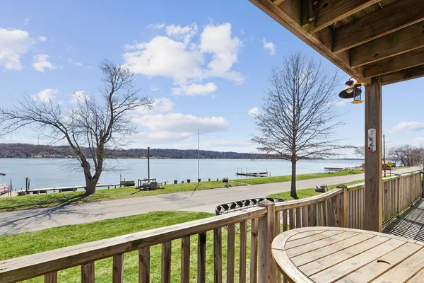 a view of a balcony with wooden floor
