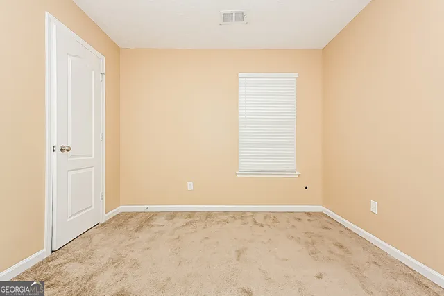 an empty room with a natural light