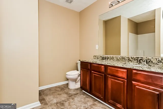 a bathroom with a sink and a toilet
